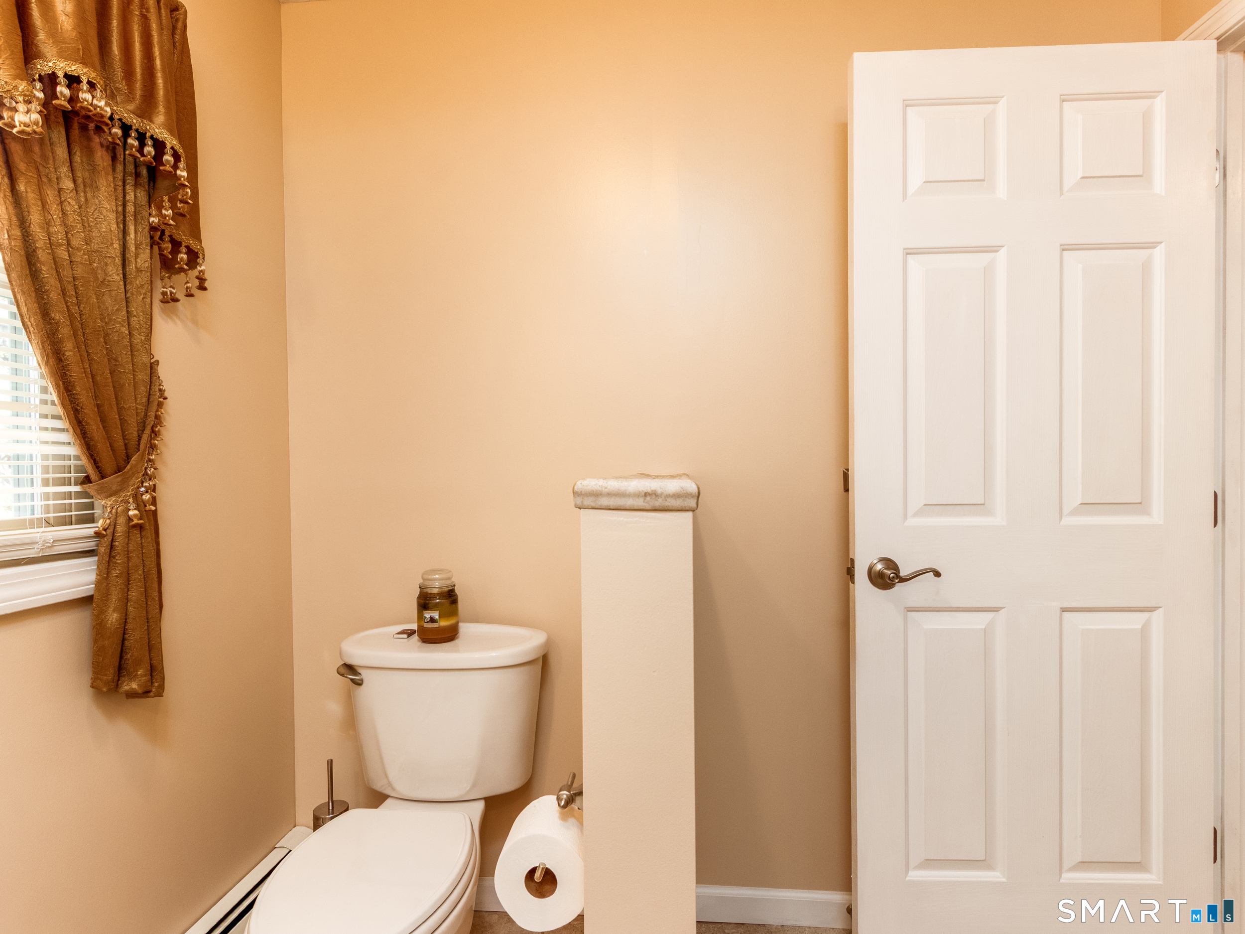 30 Lucy Street Hamden, CT 06514 - Photo 4 of 46 a white toilet sitting next to a bathroom sink