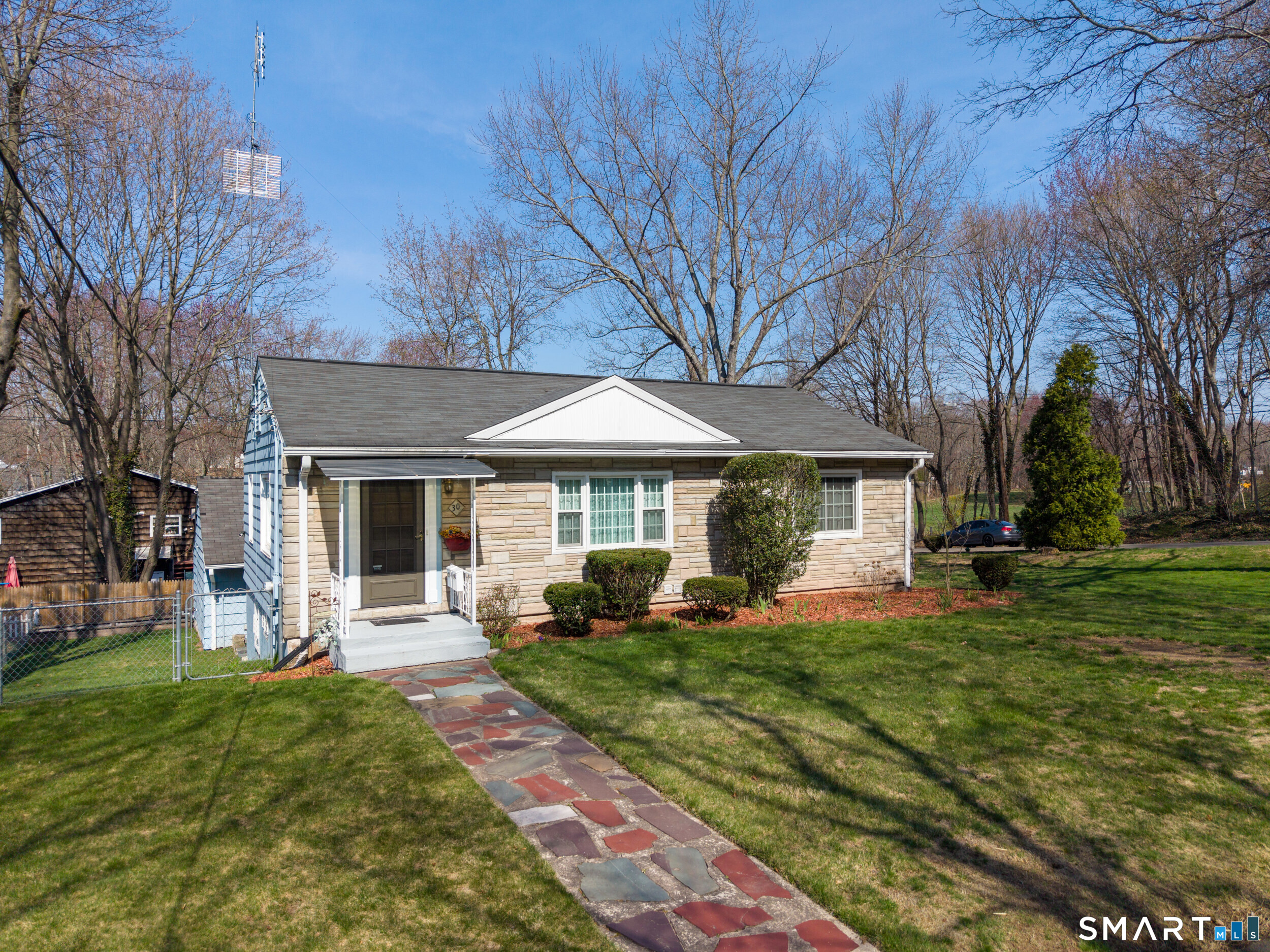 30 Lucy Street Hamden, CT 06514 - Photo 8 of 46 a front view of a house with a yard and trees