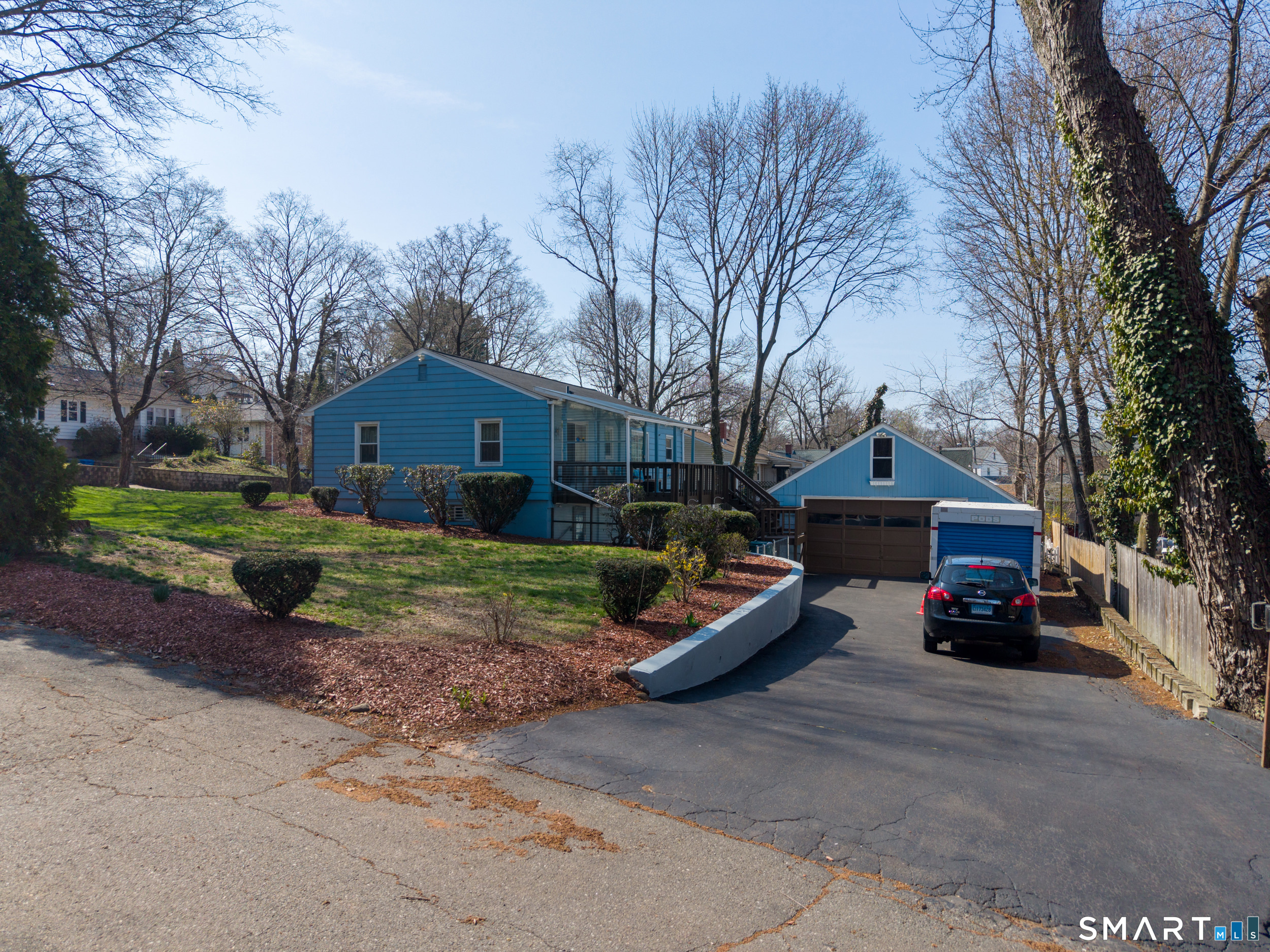 30 Lucy Street Hamden, CT 06514 - Photo 10 of 46 a front view of a house with a yard and garage