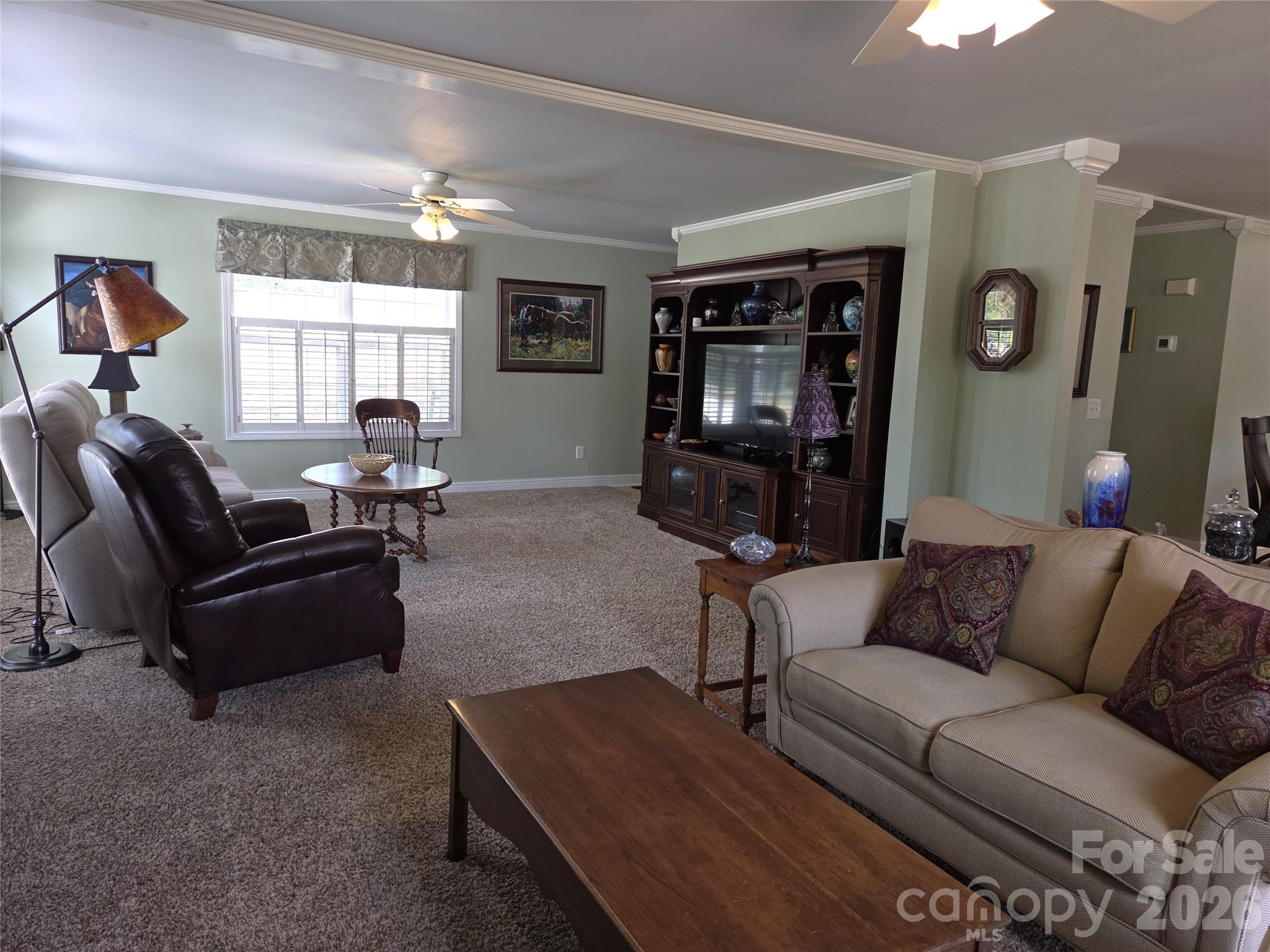 729 Sternbridge Drive Concord, NC 28025 - Photo 12 of 42 a living room with furniture and a flat screen tv