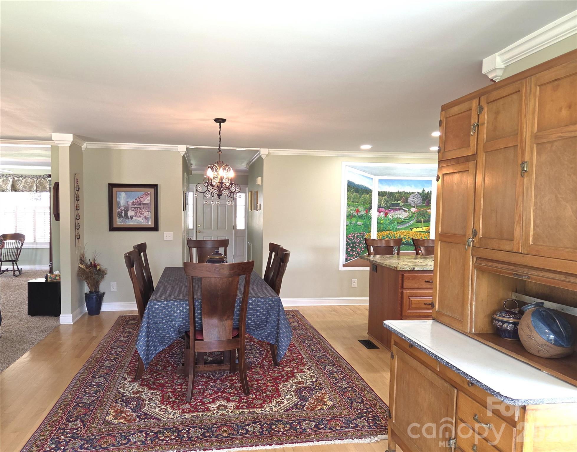 729 Sternbridge Drive Concord, NC 28025 - Photo 16 of 42 a view of a dining room with furniture window and wooden floor