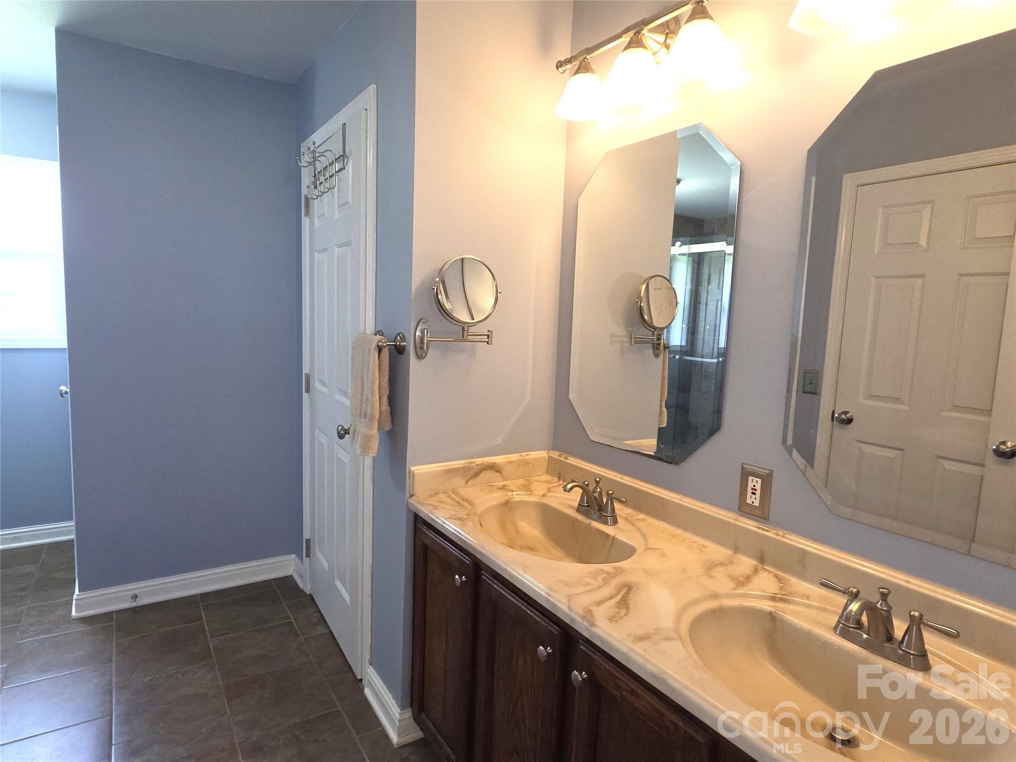 729 Sternbridge Drive Concord, NC 28025 - Photo 22 of 42 a bathroom with a granite countertop sink and a mirror