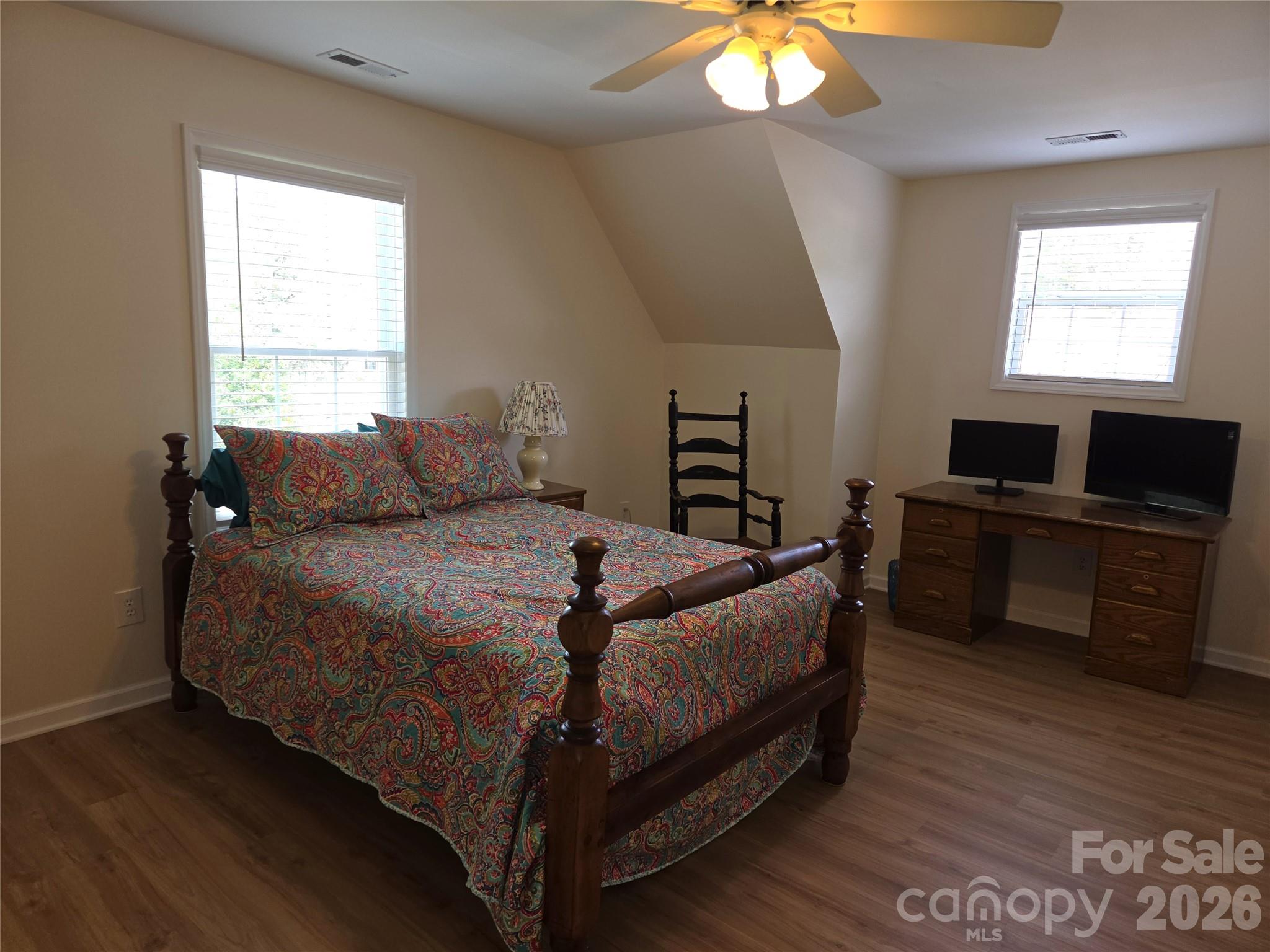 729 Sternbridge Drive Concord, NC 28025 - Photo 24 of 42 a bedroom with a bed and a chandelier