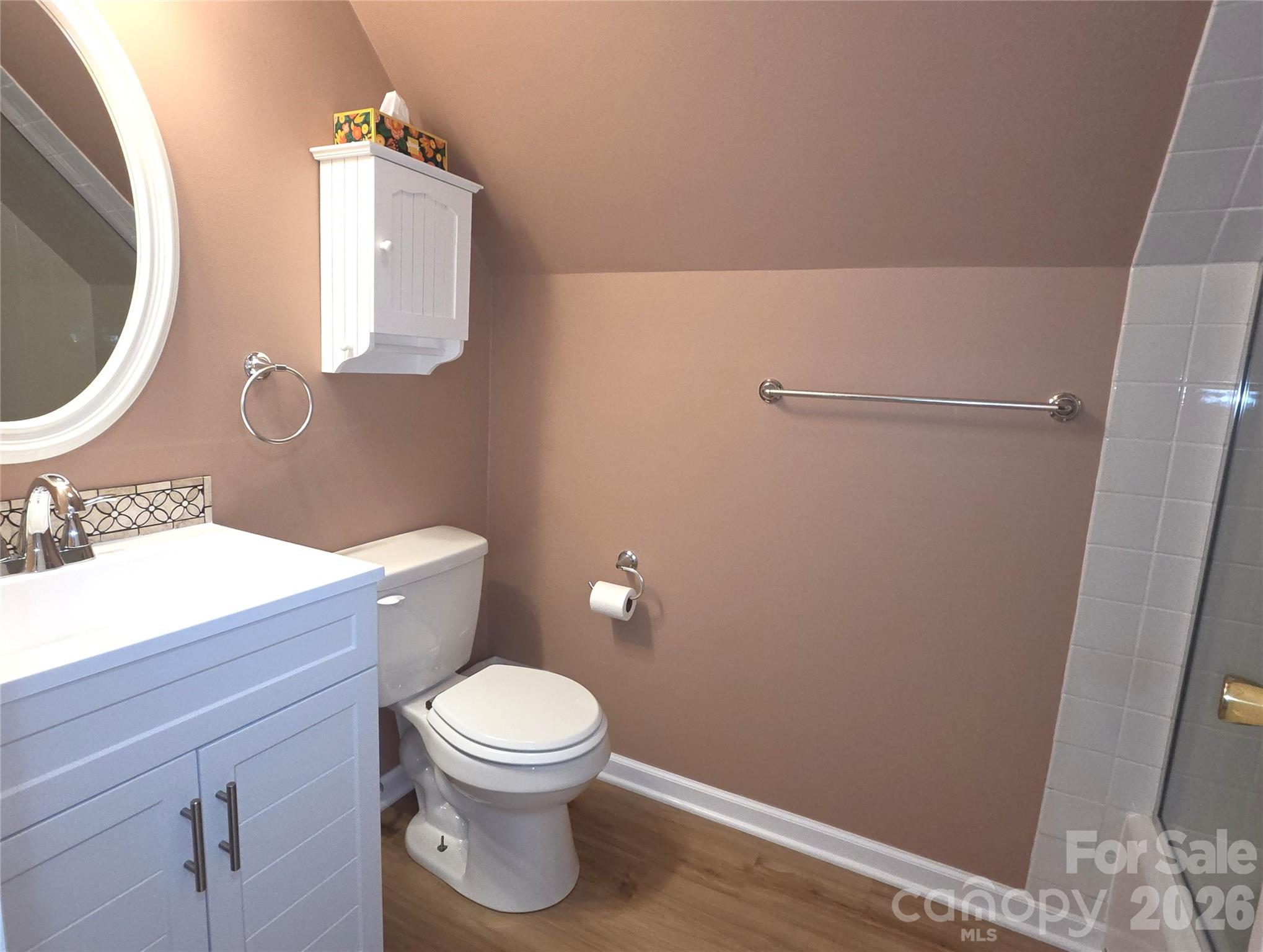 729 Sternbridge Drive Concord, NC 28025 - Photo 29 of 42 a white toilet sitting next to a bathroom sink
