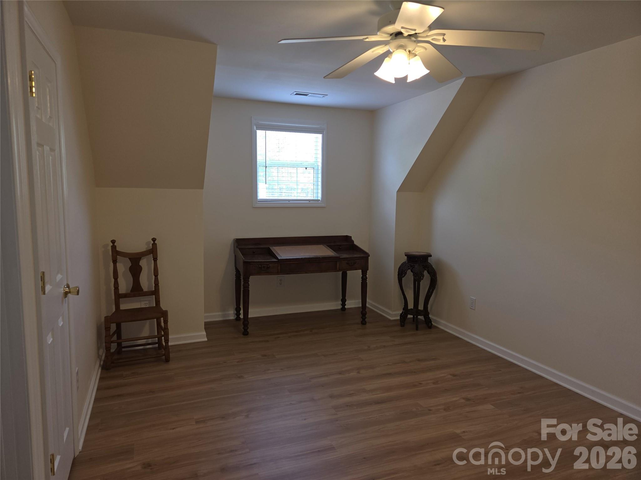 729 Sternbridge Drive Concord, NC 28025 - Photo 30 of 42 a view of empty room with wooden floor and fan