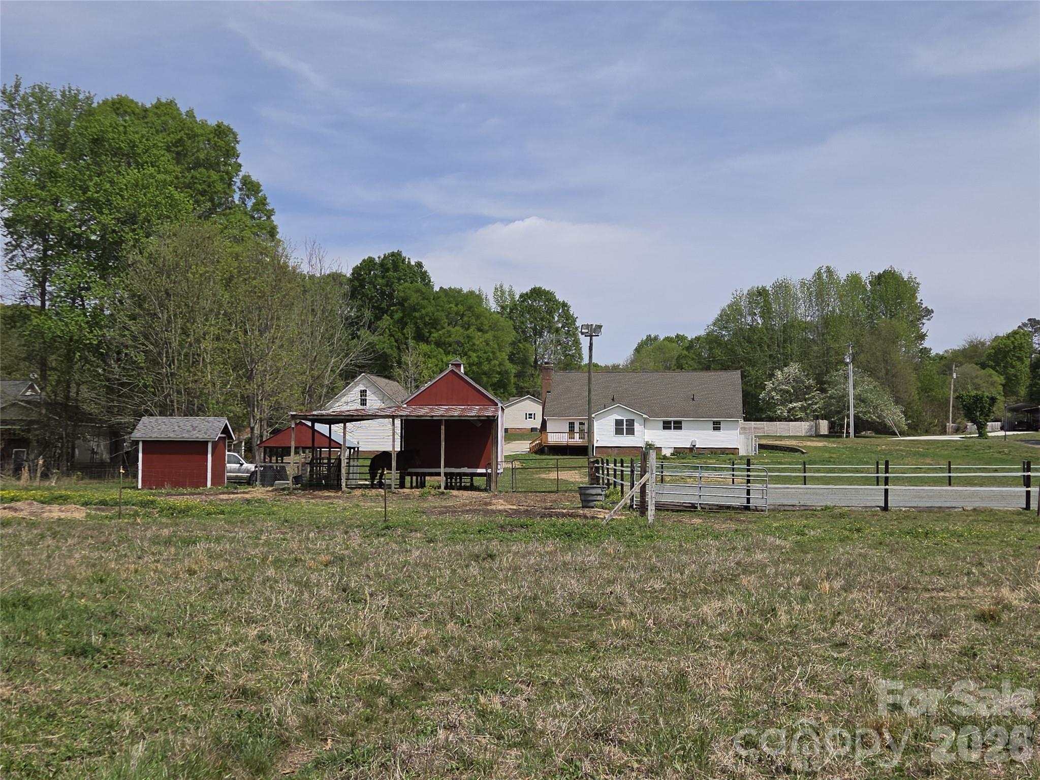 729 Sternbridge Drive Concord, NC 28025 - Photo 34 of 42 a view of a house with a yard and sitting area