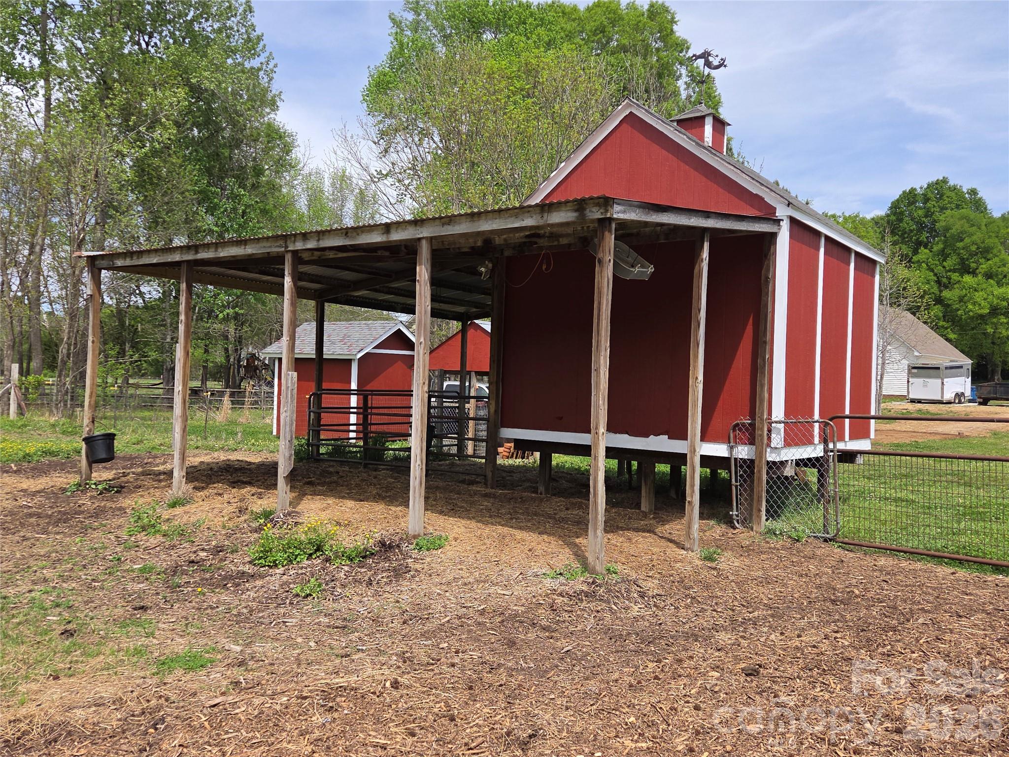 729 Sternbridge Drive Concord, NC 28025 - Photo 36 of 42 a view of a barn with a yard