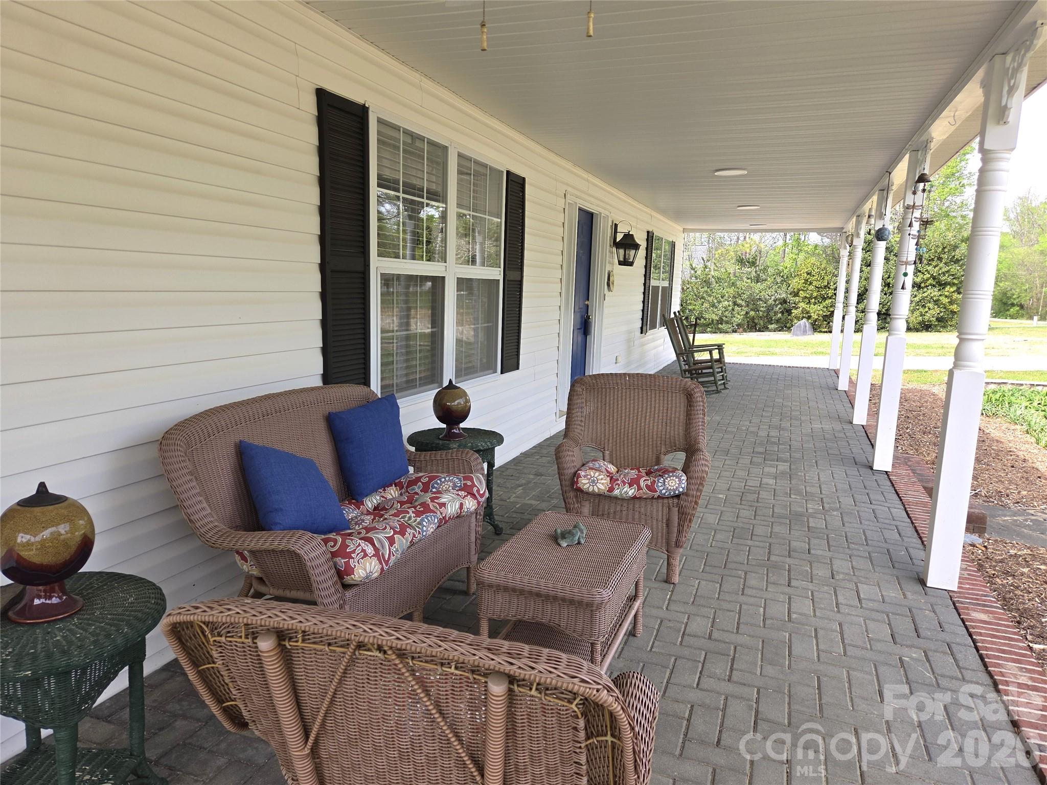 729 Sternbridge Drive Concord, NC 28025 - Photo 4 of 42 a living room with furniture and a floor to ceiling window