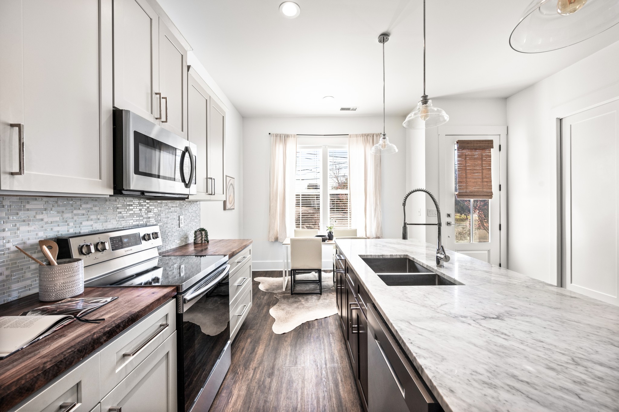 1000 Free Silver Road Nashville, TN 37207 - Photo 13 of 45 a kitchen with stainless steel appliances granite countertop a sink stove and cabinets