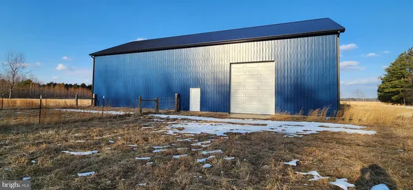 a view of a backyard of the house