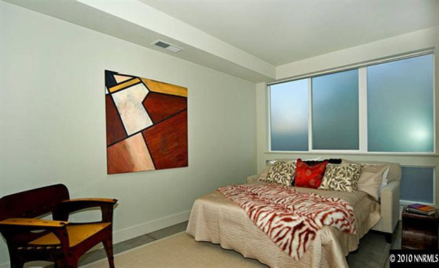 375 Pine Street Reno, NV 89501 - Photo 3 of 4 a bedroom with a bed and wooden floor