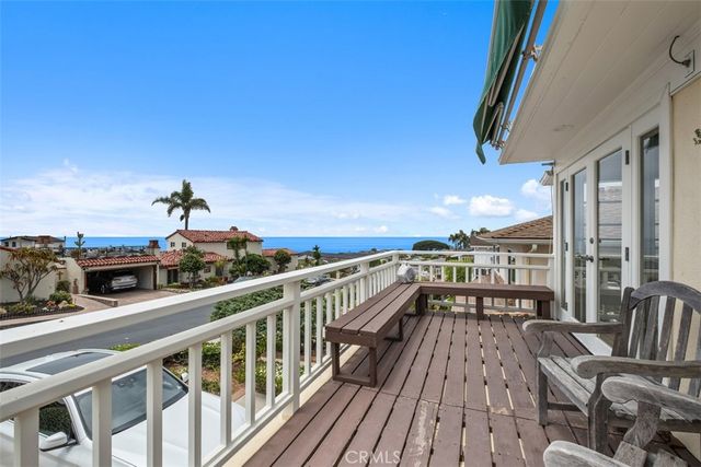 a view of a balcony with chairs
