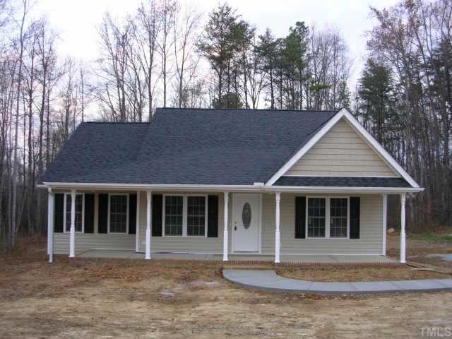 33 Punch Hill Farm Road Rougemont, NC 27572 - Photo 1 of 1 a house that has a tree in front of it