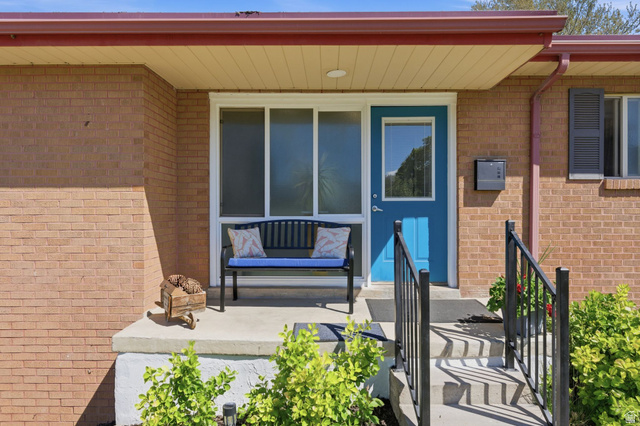 935 900 North Bountiful, UT 84010 - Photo 5 of 46 Entrance to property featuring brick siding and covered porch
