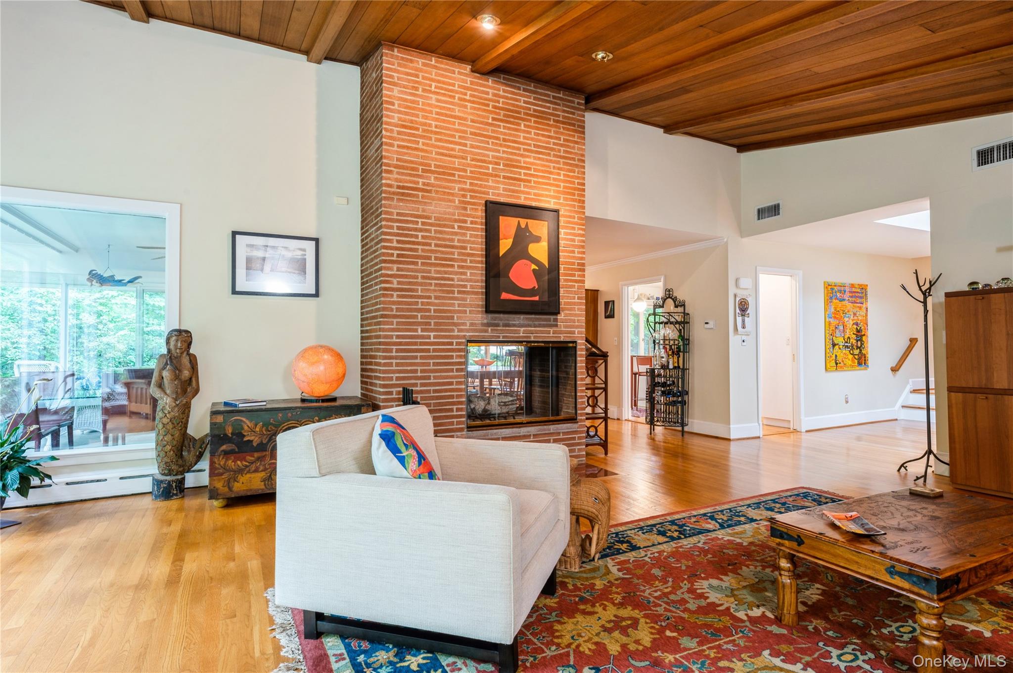 160 Hampshire Road Bronxville, NY 10708 - Photo 12 of 36 a living room with furniture and a flat screen tv