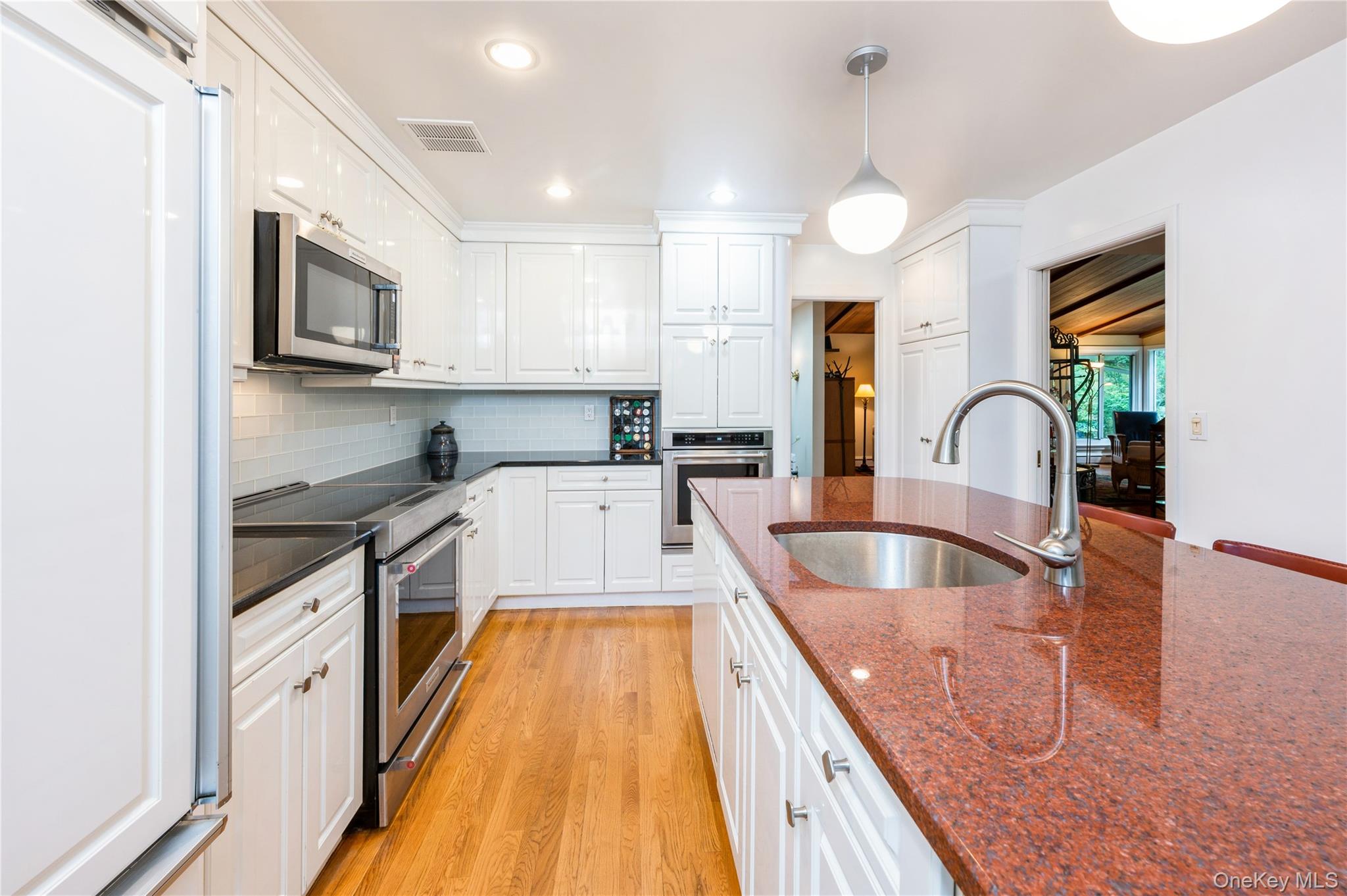 160 Hampshire Road Bronxville, NY 10708 - Photo 19 of 36 a kitchen with stainless steel appliances granite countertop a sink and a stove