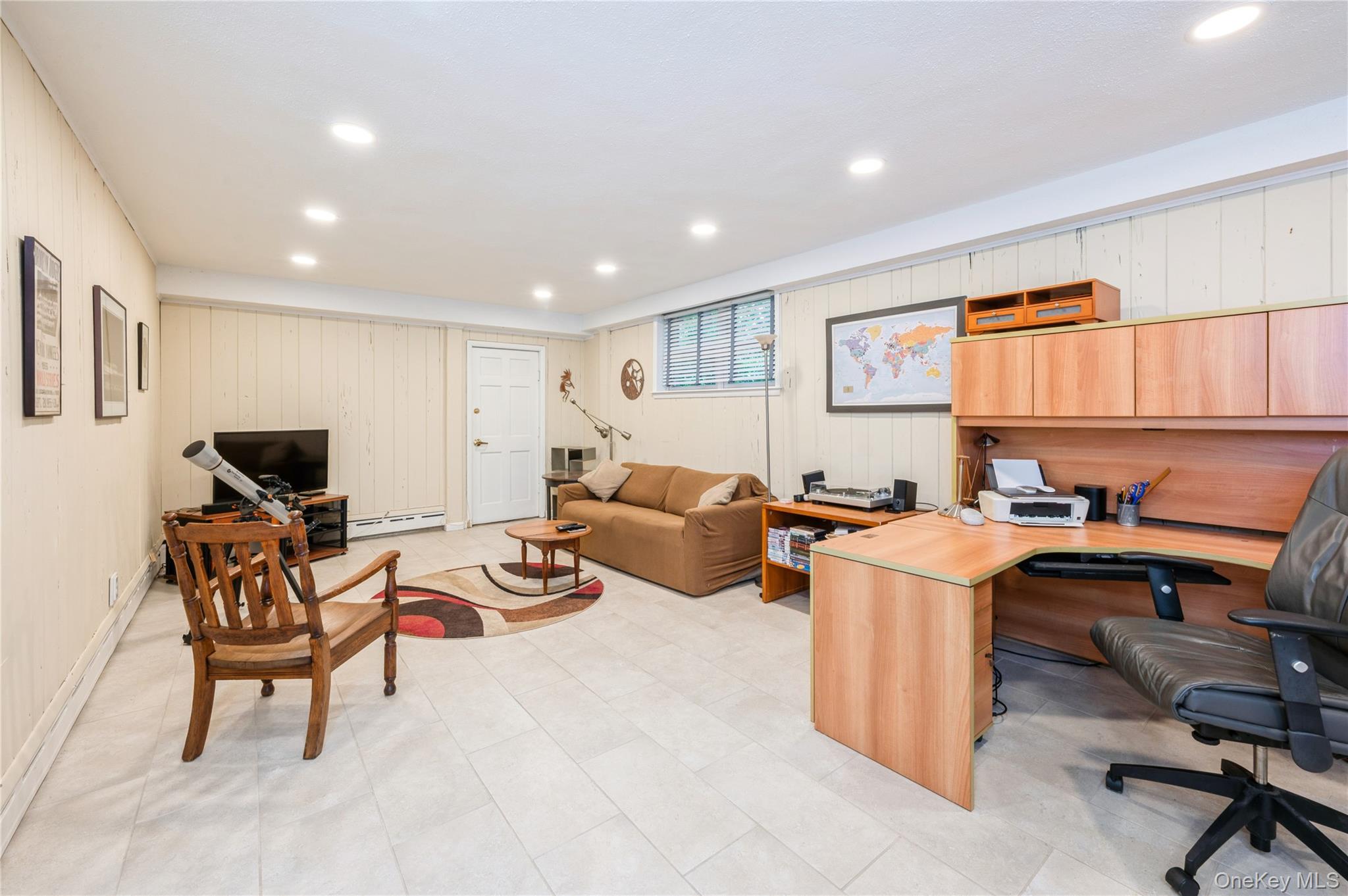 160 Hampshire Road Bronxville, NY 10708 - Photo 22 of 36 a living room with furniture a computer on the desk and chair