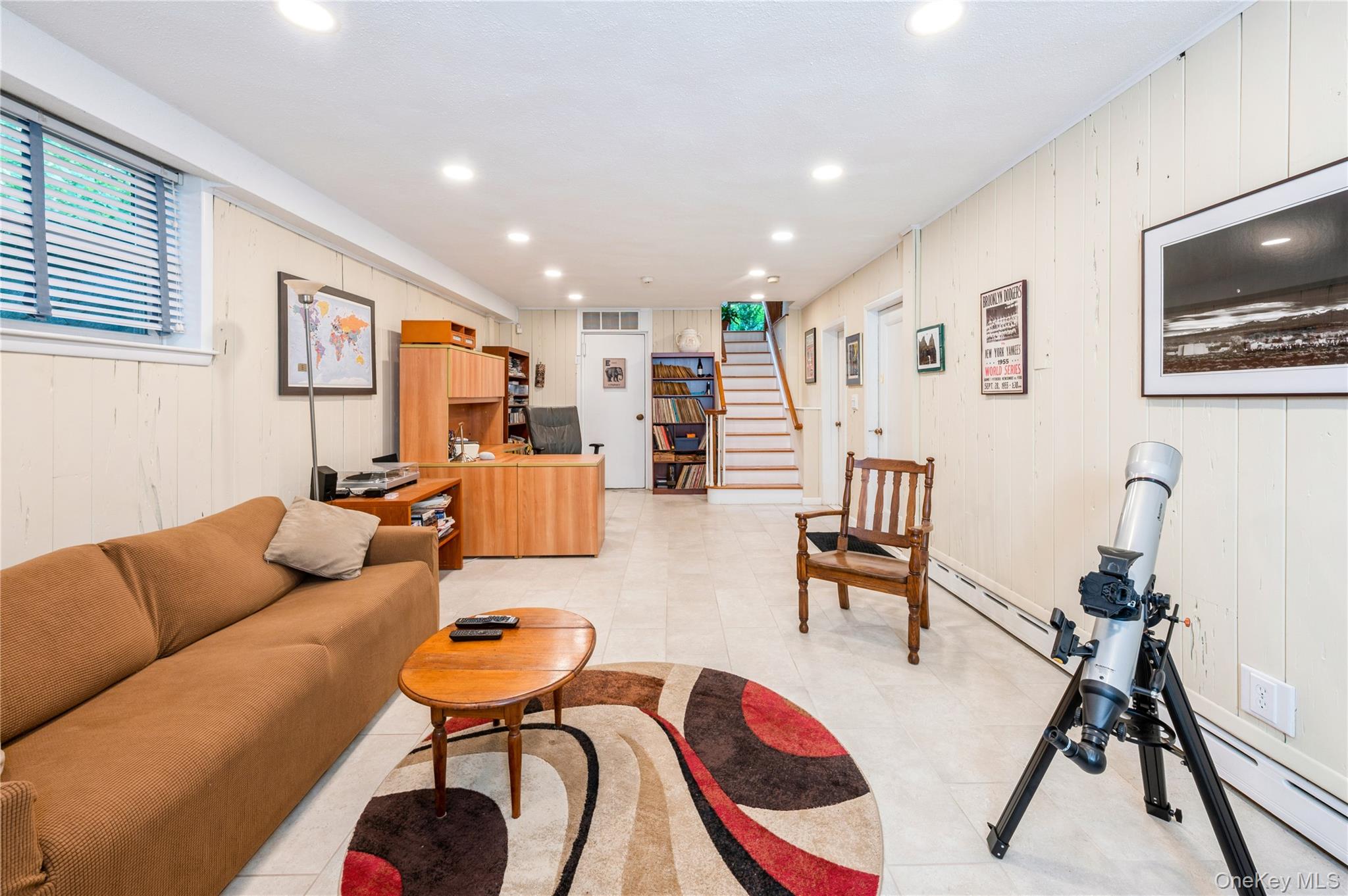 160 Hampshire Road Bronxville, NY 10708 - Photo 23 of 36 a living room with furniture kitchen view and a flat screen tv