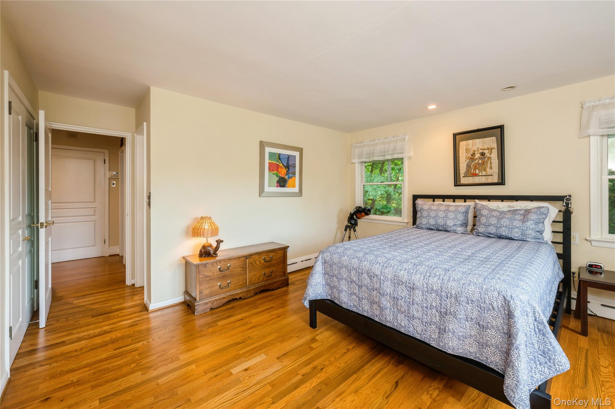160 Hampshire Road Bronxville, NY 10708 - Photo 27 of 36 a bedroom with a bed and wooden floor
