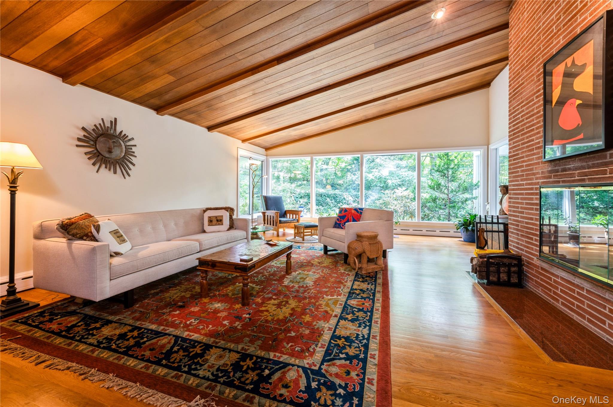 160 Hampshire Road Bronxville, NY 10708 - Photo 6 of 36 a living room with furniture floor to ceiling window and a table