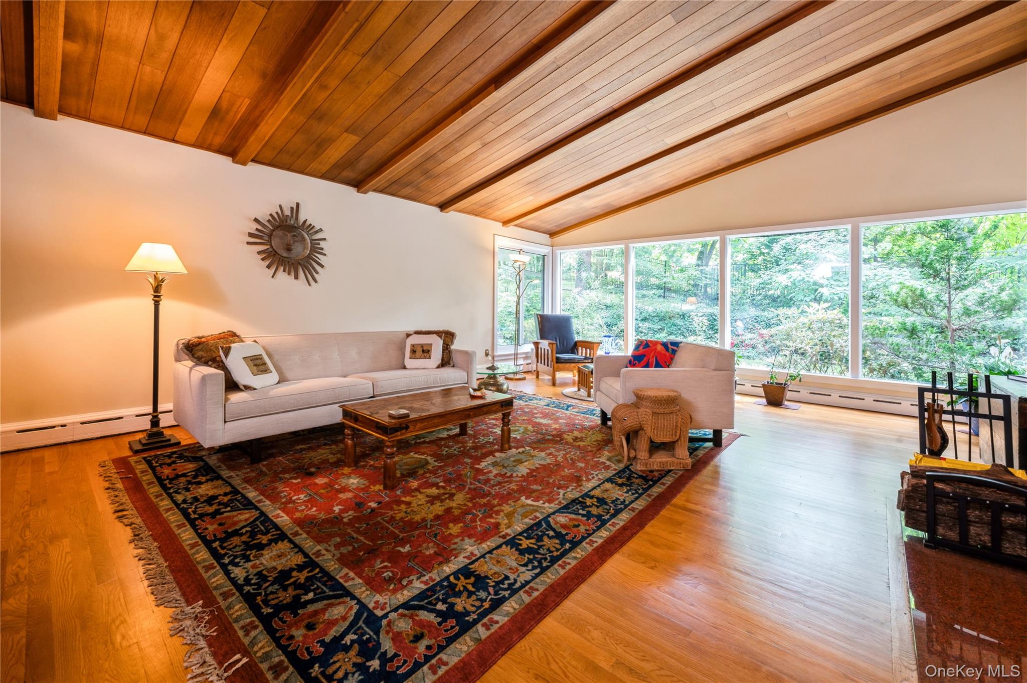 160 Hampshire Road Bronxville, NY 10708 - Photo 7 of 36 a living room with furniture stove and a table