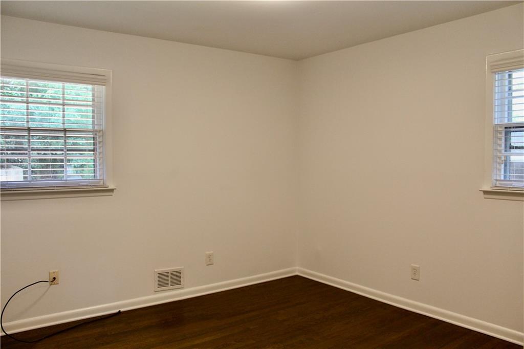 1191 Hampton Way Northeast Atlanta, GA 30324 - Photo 14 of 31 a view of a small space with wooden floor and a window