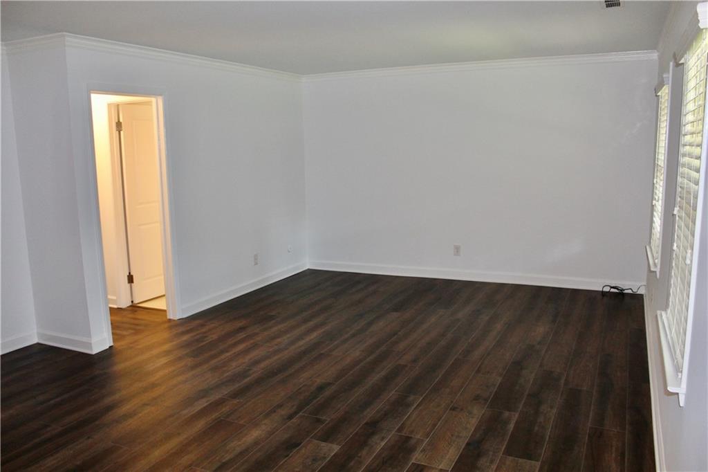 1191 Hampton Way Northeast Atlanta, GA 30324 - Photo 17 of 31 a view of an empty room and wooden floor