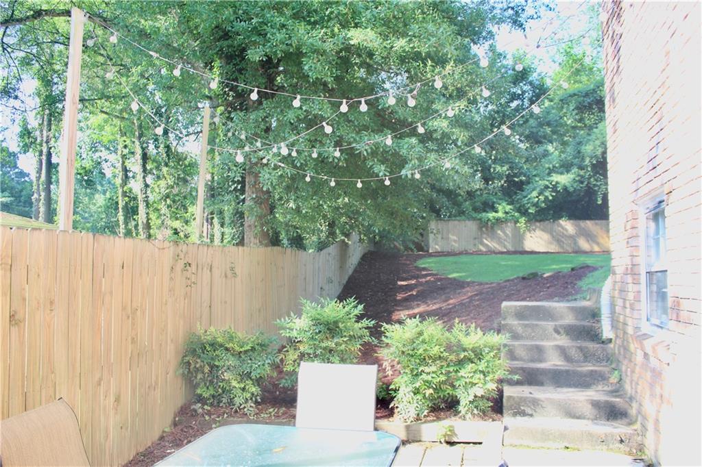 1191 Hampton Way Northeast Atlanta, GA 30324 - Photo 21 of 31 a view of a backyard with plants