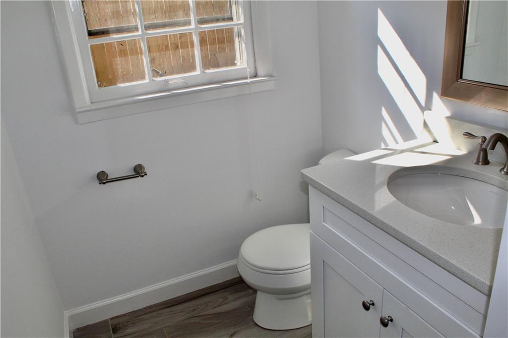 1191 Hampton Way Northeast Atlanta, GA 30324 - Photo 22 of 31 a bathroom with a sink and a toilet