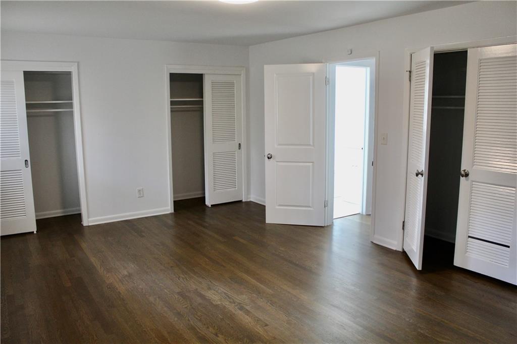 1191 Hampton Way Northeast Atlanta, GA 30324 - Photo 26 of 31 an empty room with wooden floor and closet