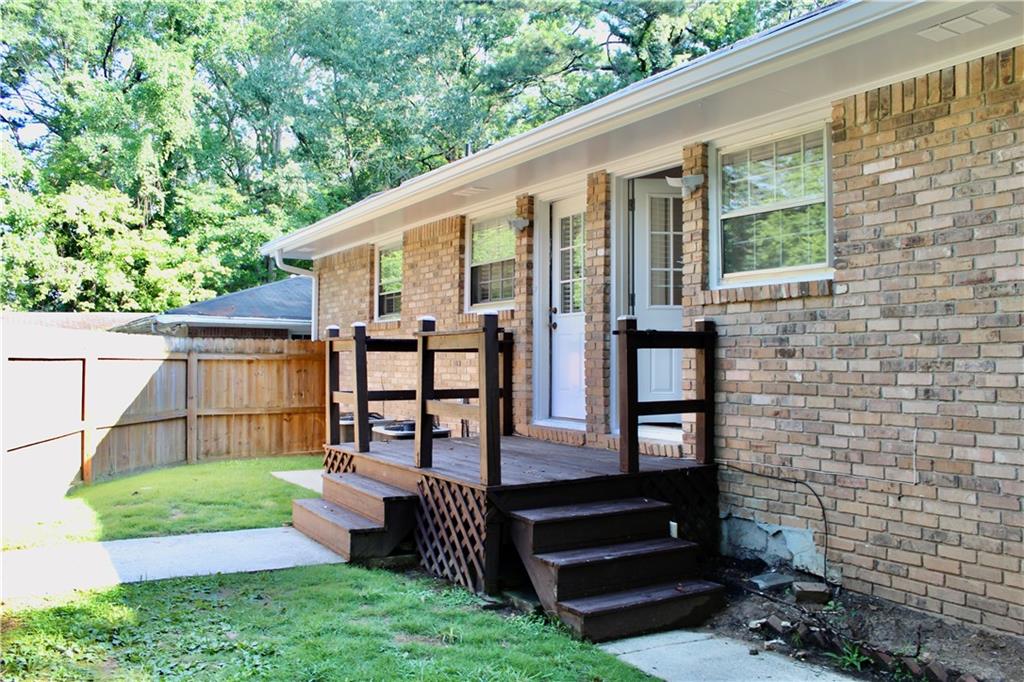 1191 Hampton Way Northeast Atlanta, GA 30324 - Photo 4 of 31 a view of a house with backyard and porch
