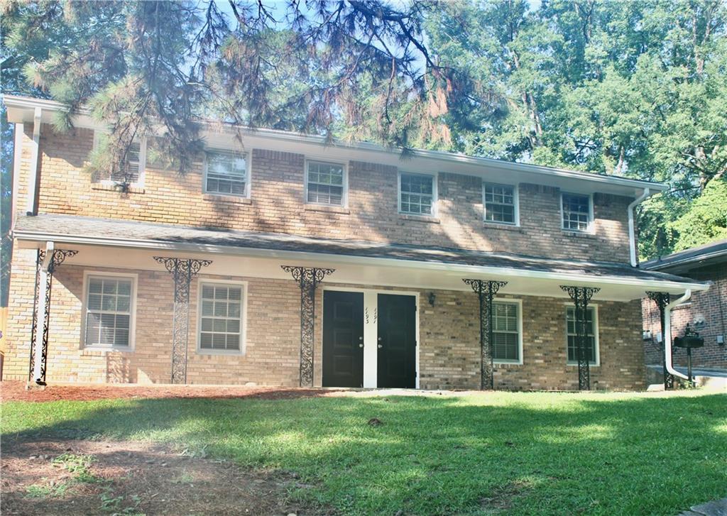 1191 Hampton Way Northeast Atlanta, GA 30324 - Photo 5 of 31 front view of a house with a yard