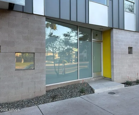 a view of a brick house with a outdoor space