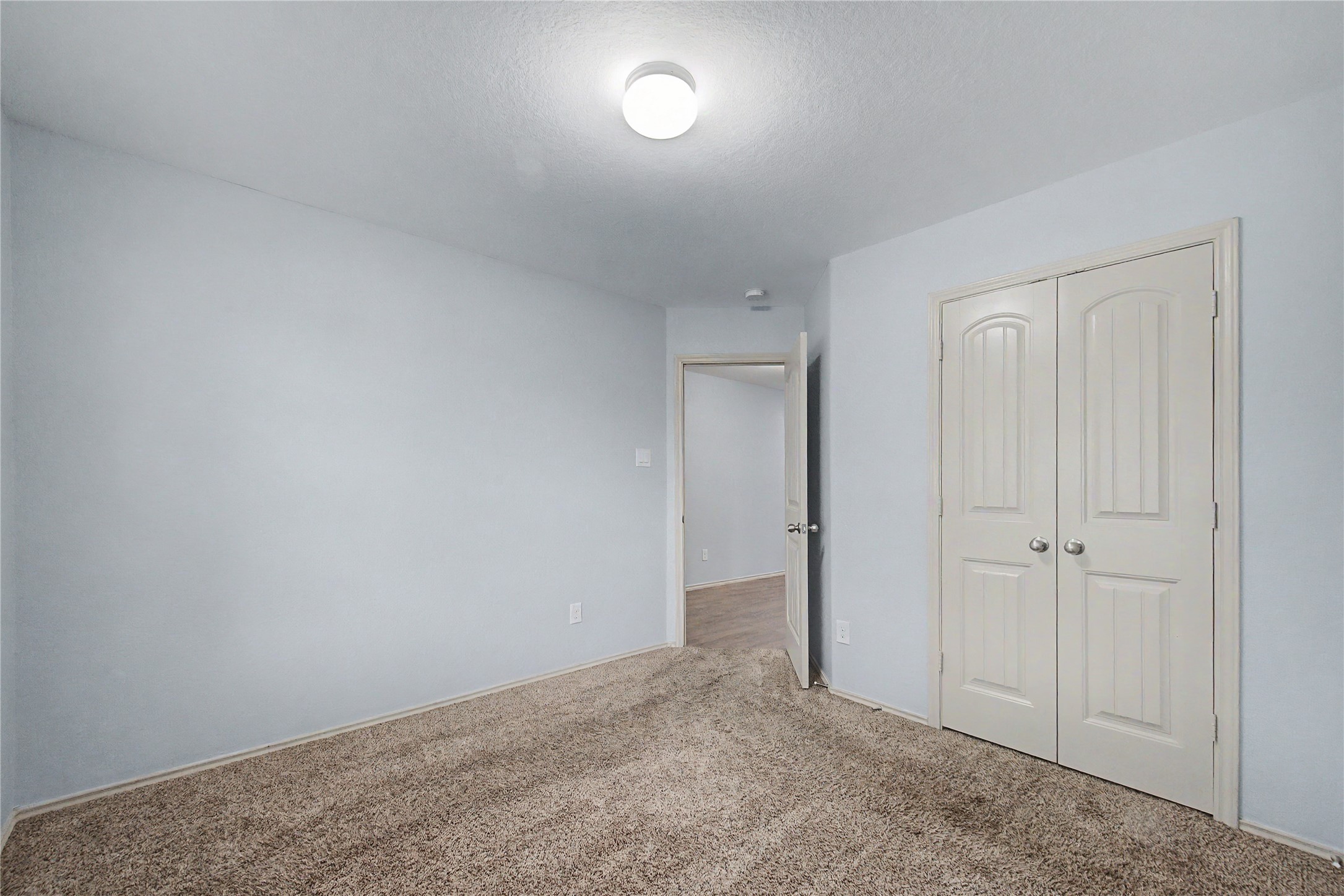 16430 Rodeo River Road Houston, TX 77049 - Photo 8 of 34 a view of an empty room and a window