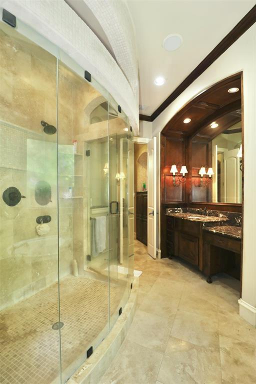 1609 Singletree Court McKinney, TX 75072 - Photo 20 of 38 a large bathroom with a glass shower door and a sink