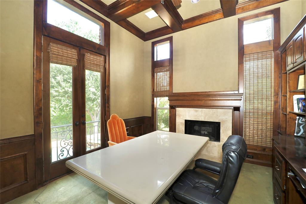 1609 Singletree Court McKinney, TX 75072 - Photo 22 of 38 a bed room with furniture and a fireplace