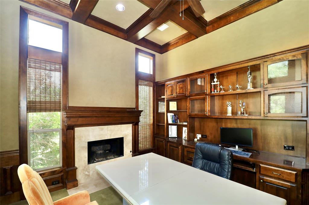 1609 Singletree Court McKinney, TX 75072 - Photo 23 of 38 a living room with furniture a fireplace and a flat screen tv