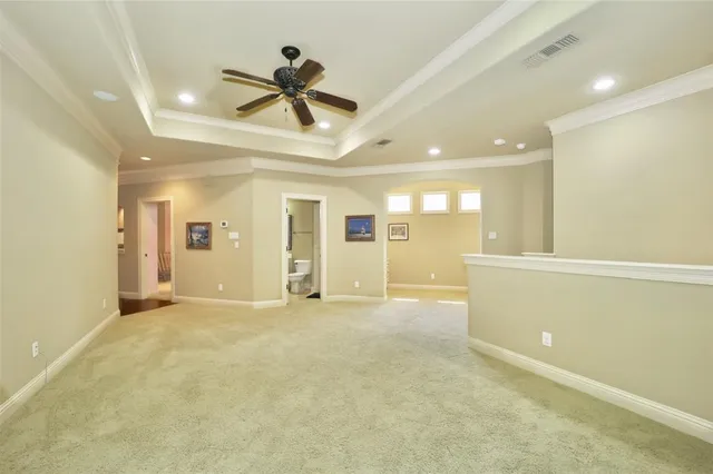 a view of a livingroom with a ceiling fan