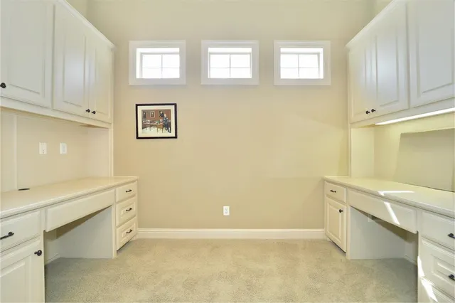 a view of cabinets and window