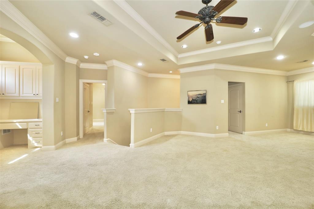 1609 Singletree Court McKinney, TX 75072 - Photo 26 of 38 an empty room with a cabinet and mirrors