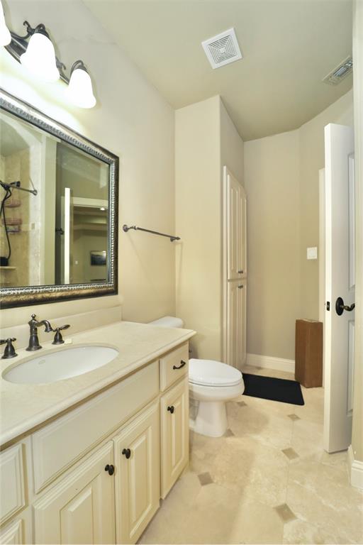 1609 Singletree Court McKinney, TX 75072 - Photo 28 of 38 a bathroom with a sink a toilet and shower