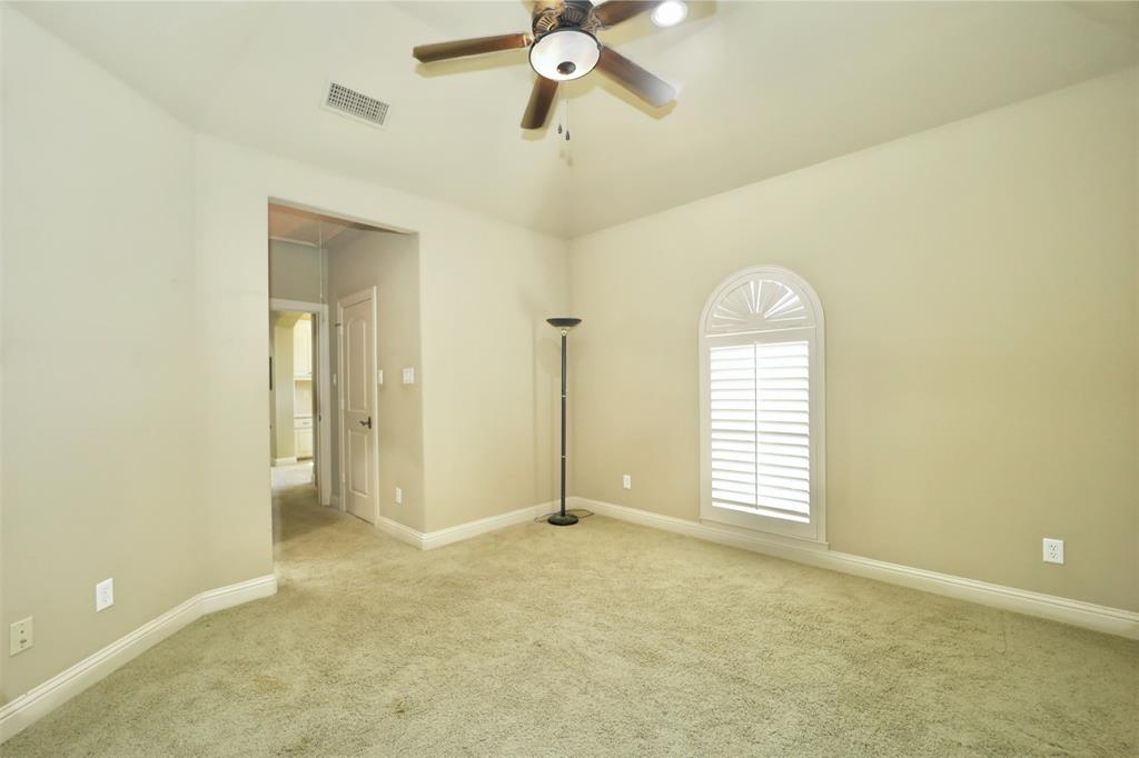 1609 Singletree Court McKinney, TX 75072 - Photo 29 of 38 a view of empty room with a window and a ceiling fan