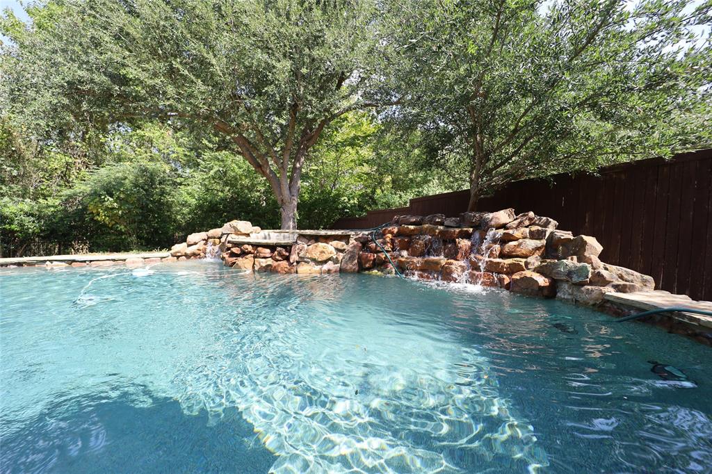1609 Singletree Court McKinney, TX 75072 - Photo 37 of 38 a backyard of a house with lots of green space