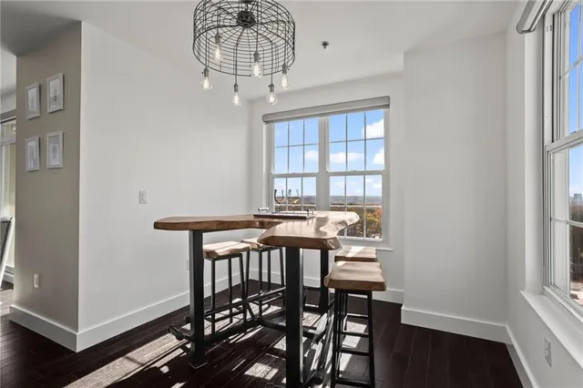 a view of a dining room with furniture window and wooden floor