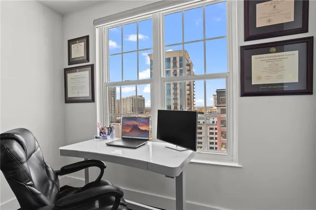 a view of a workspace with furniture