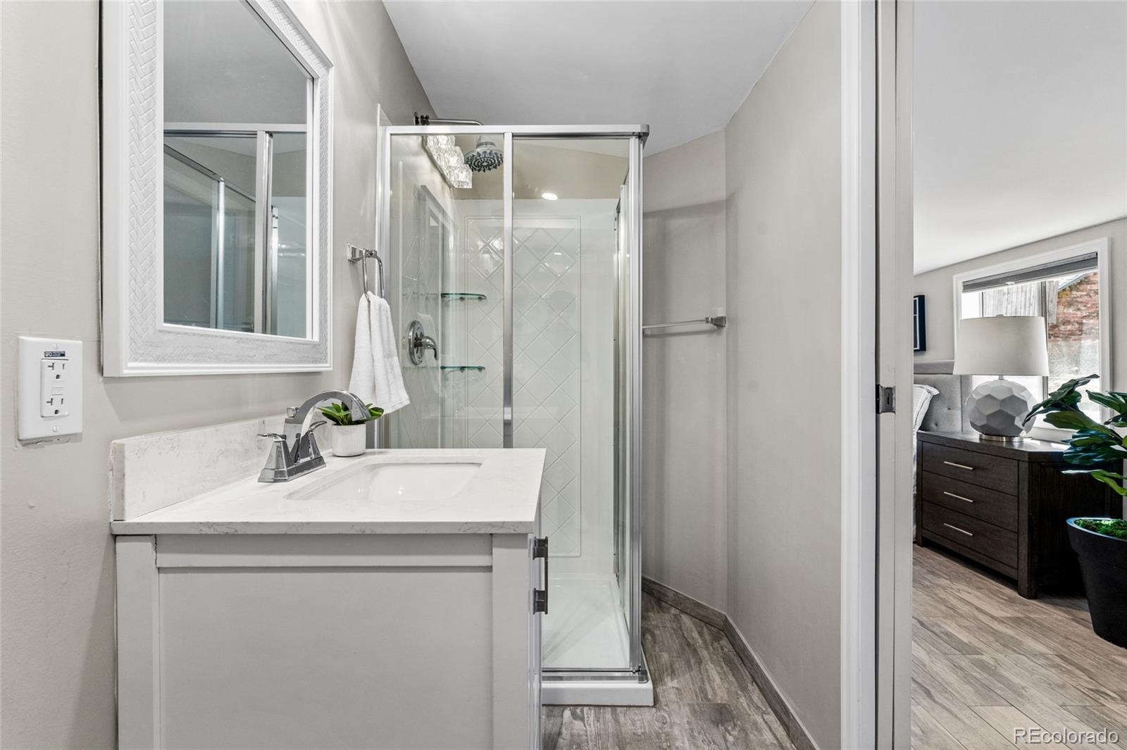 2259 Depew Street Edgewater, CO 80214 - Photo 24 of 46 a bathroom with a sink vanity and a mirror