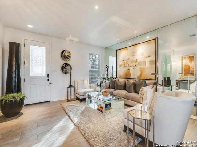 a living room with furniture and a large window