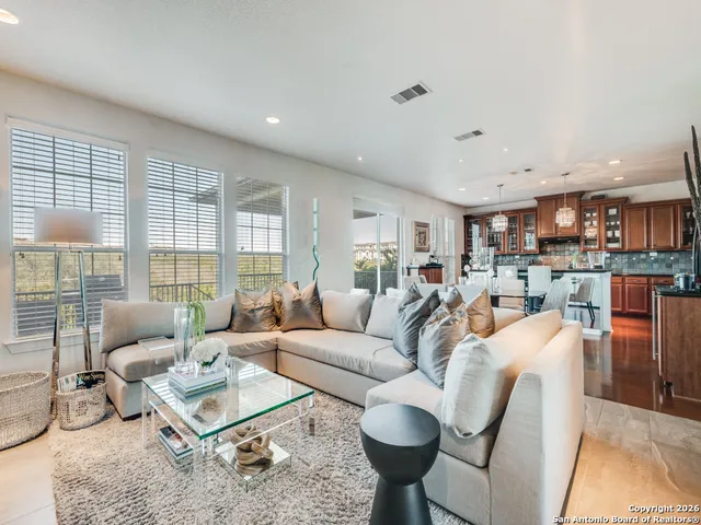 a living room with furniture and a large window