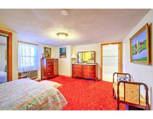 31 Kilburn Road Newton, MA 02465 - Photo 16 of 29 a bedroom with a bed and dresser with mirror