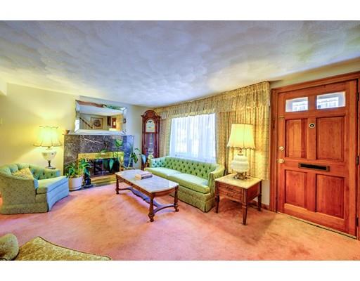 31 Kilburn Road Newton, MA 02465 - Photo 3 of 29 a living room with furniture a fireplace and large windows